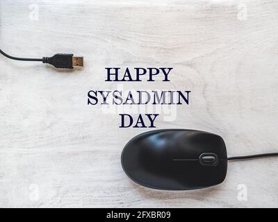 Happy Sysadmin Day. Beautiful greeting card. Close-up, view from above. Preparation for a professional holiday. Congratulations for family, relatives, Stock Photo