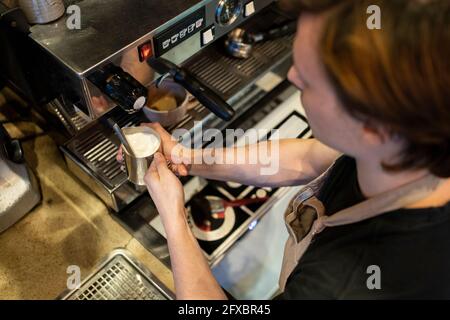 Barista making coffee at cafe Stock Photo