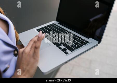 Young woman using laptop Stock Photo