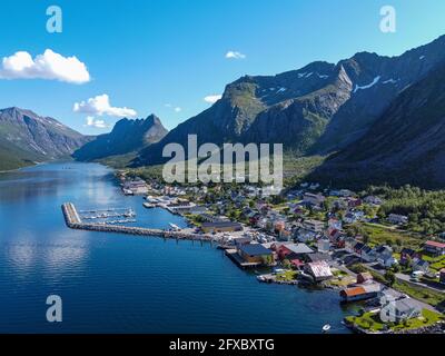 Norway, Troms og Finnmark, Gryllefjord, Aerial view of fishing village located along Gryllefjorden on Senja island Stock Photo