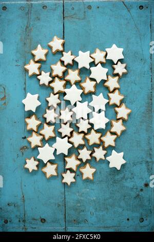 Christmas cinnamon star shaped cookies on blue rustic wooden background Stock Photo
