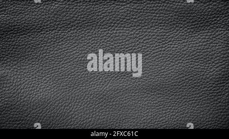 Close-up of detailed dark gray or black faux leather surface. High resolution full frame textured background. Stock Photo