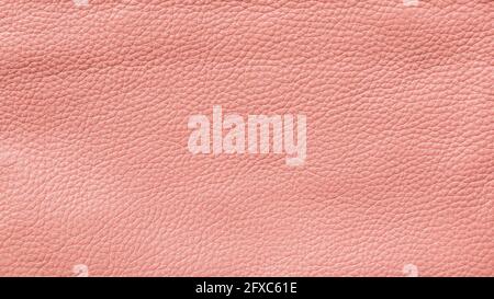 Close-up of detailed pink faux leather surface. High resolution full frame textured background. Stock Photo