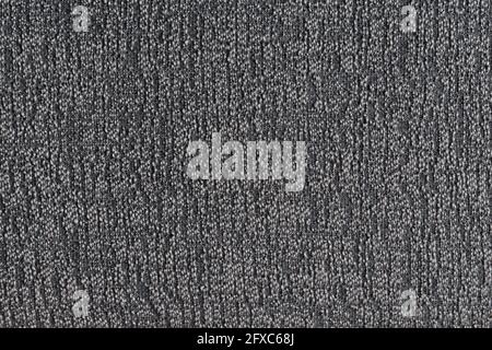 Close-up of black and white furniture fabric material, top view. High resolution full frame textured background. Stock Photo