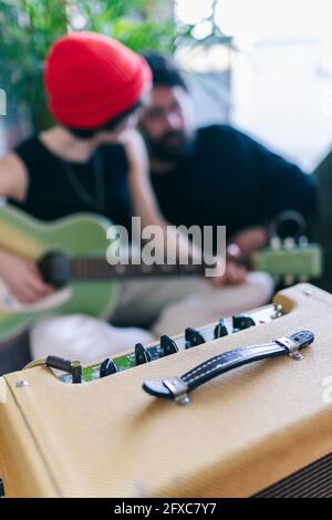 Male and female musicians with musical instruments in studio Stock Photo