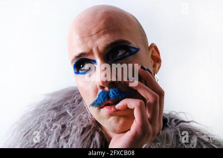 Thoughtful man looking away against white background Stock Photo