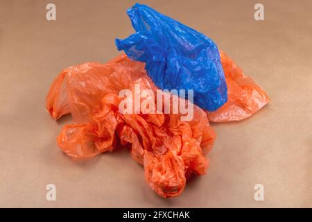 Studio shot of blue and orange plastic bags Stock Photo