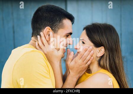 Affectionate couple smiling while looking at each other Stock Photo