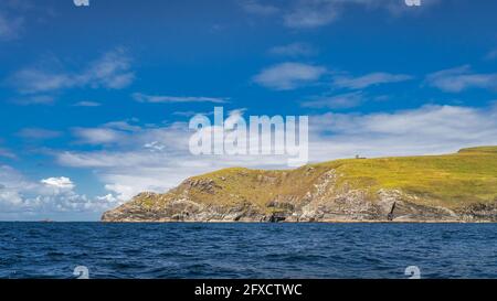 Bray Head coastline seen from Kerry Cliffs and blue waters of Atlantic Ocean on a summer day, Portmagee, Iveragh Peninsula, Ring of Kerry, Ireland Stock Photo