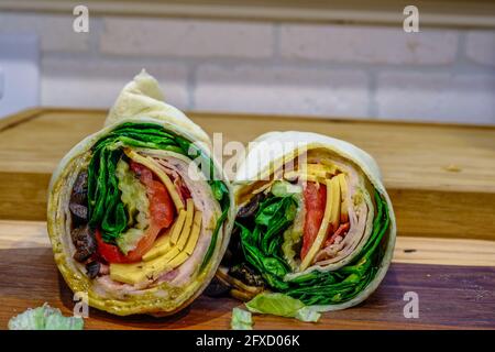 Fresh Meat and Veggie Wrap Cut in Half Stock Photo