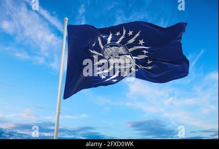 flag of Cambridge, Massachusetts at cloudy sky background on sunset, panoramic view. Patriotic concept about Cambridge, Massachusetts and copy space f Stock Photo