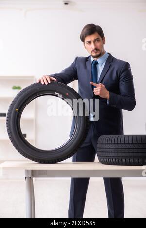 Young businessman selling tires in the office Stock Photo