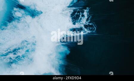 Powerful wave breaking in an overhead view from a drone Stock Photo