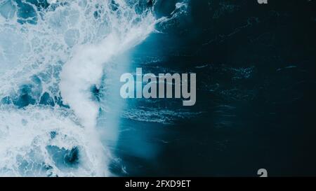 Powerful wave breaking in an overhead view from a drone Stock Photo
