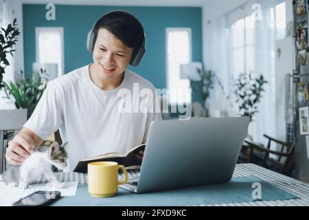 Asian businessman talking to colleague team in video call confer Stock Photo