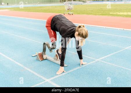 Side view of female athlete with prosthetic leg Stock Photo