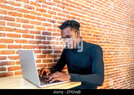 young african man working from his laptop Stock Photo