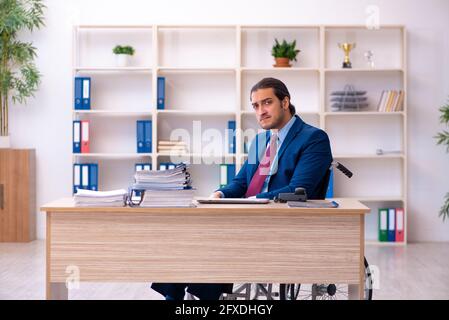 Young male disabled employee working in the office Stock Photo