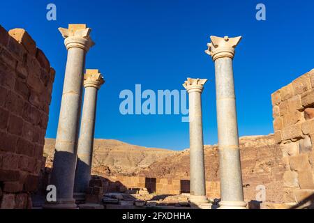 four columns of the Blue Chapel made of blue Egyptian granite, Nabataean horned capitals, North Ridge,  5th - 6th century, Petra, Jordan Stock Photo