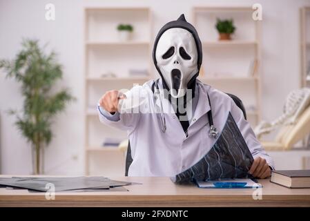 Devil doctor radiologist working at the hospital Stock Photo