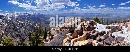 Wasatch Front Mount Olympus Peak hiking trail inspiring views in spring via Bonneville Shoreline, Rocky Mountains, Salt Lake City, Utah. United States Stock Photo