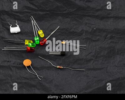 Electronic components, technology, scattered on dark background Stock Photo