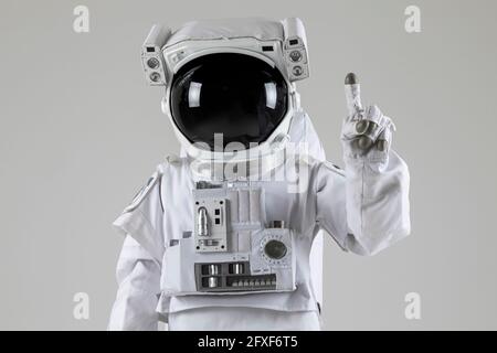 astronaut counting numbers, white background Stock Photo