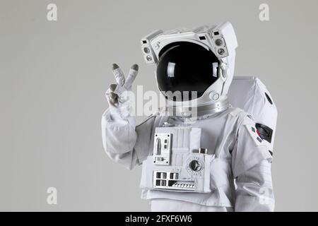 astronaut counting numbers, white background Stock Photo