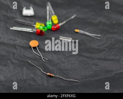 Electronic components, technology, scattered on dark background Stock Photo