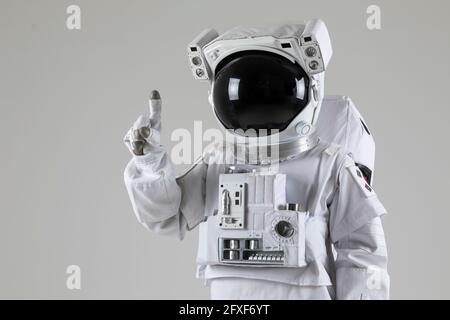 astronaut counting numbers, white background Stock Photo