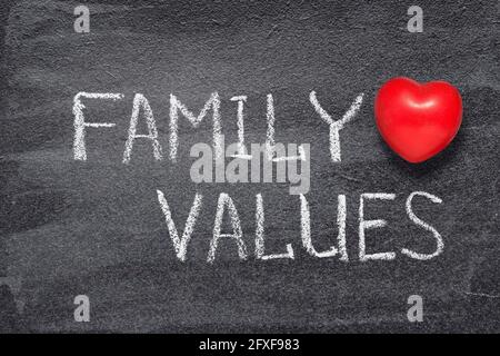 family values phrase written on chalkboard with red heart symbol Stock Photo