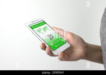 Smarfone with health passport of vaccination certification. Checking Covid-19 Vaccine Passport On Cellphone. Stock Photo