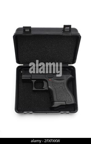 automatic pistol in a black plastic box Stock Photo