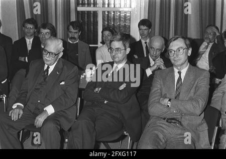 Van Dijk (r) receives booklet on the right of inquiry from author mr. drs. A. A. M. Dolle, December 10, 1985, The Netherlands, 20th century press agency photo, news to remember, documentary, historic photography 1945-1990, visual stories, human history of the Twentieth Century, capturing moments in time Stock Photo