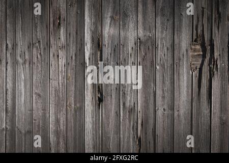 Old wood siding detail, faded and worn vintage background or texture Stock Photo
