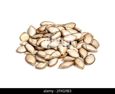 handful of unhusked Pumpkin seeds closeup on white background Stock Photo