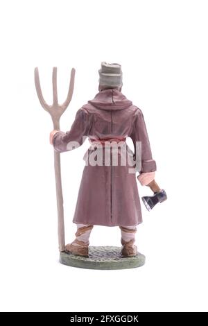 tin soldier man with a pitchfork Isolated on white Stock Photo