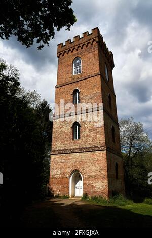 The gothic tower at Painshill Park, an 18th century landscape garden in Cobham, Surrey. Picture date: Wednesday May 26, 2021. Stock Photo