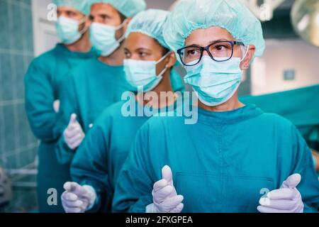 Exhausted surgeons at the emergency room as a sign of stress and overwork Stock Photo