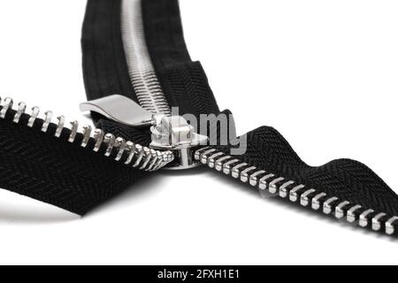 macro of open metal zipper with black fabric isolated on white background Stock Photo