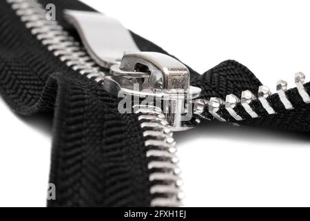 macro of open metal zipper with black fabric isolated on white background Stock Photo