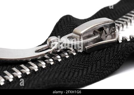 macro of metal zipper with black fabric isolated on white background Stock Photo