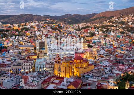 Guanajuato City, Mexico, aerial view of cityscape including historical landmark Basilica of Our Lady of Guanajuato at dusk. Stock Photo