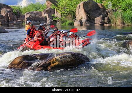 Pacuare River, Costa Rica -MAY  15 2021: Rafting team , summer extreme water sport. Group of people in a rafting boat, beautiful adrenaline ride down Stock Photo