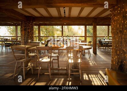 Autumn pumpkins and gourds on rustic table in restaurant Stock Photo
