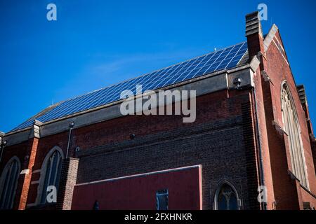 Solar energy generated on roof of church Stock Photo