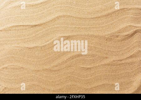 Smooth beach sand texture, top view. Stock Photo