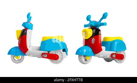 Isolated photo of multi colored plastic scooter toy on white background. Stock Photo