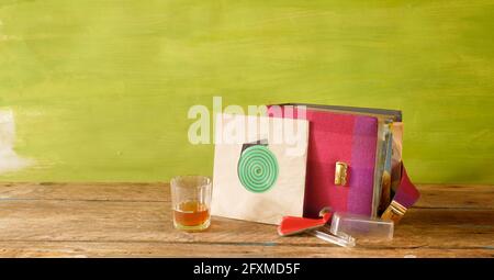 Old grungy vinyl record with yellowed blank sleeve,record album,record brush,vintage style with free copy space, isolated on white Stock Photo