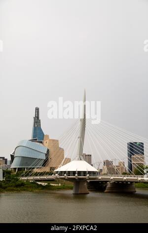 The Provecher Bridge crosses the Red River in Winnipeg, Canada. The bridge stands close to the Canadian Museum for Human Rights. Stock Photo